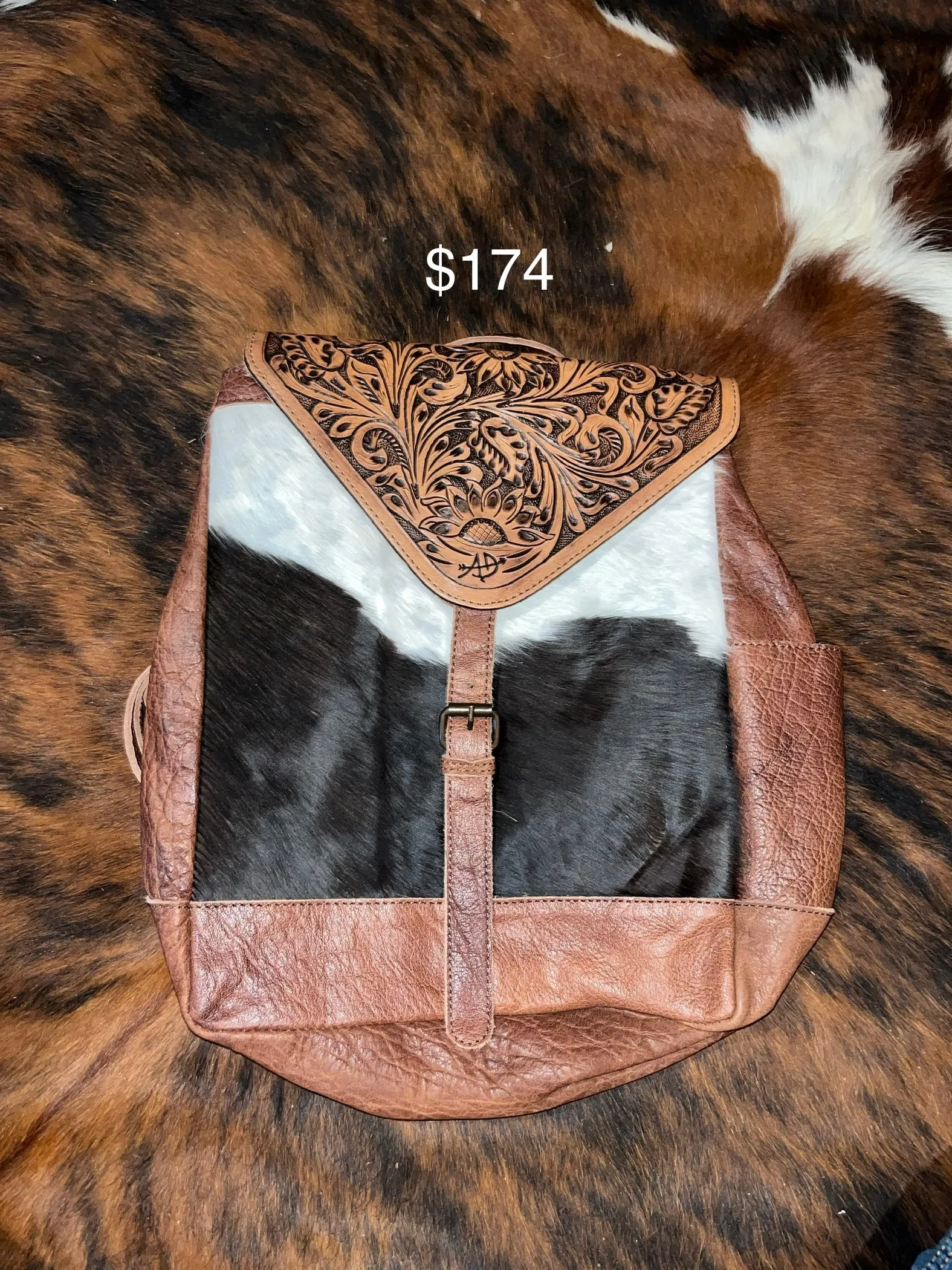 Cowhide and tooled leather concealed carry backpack purse