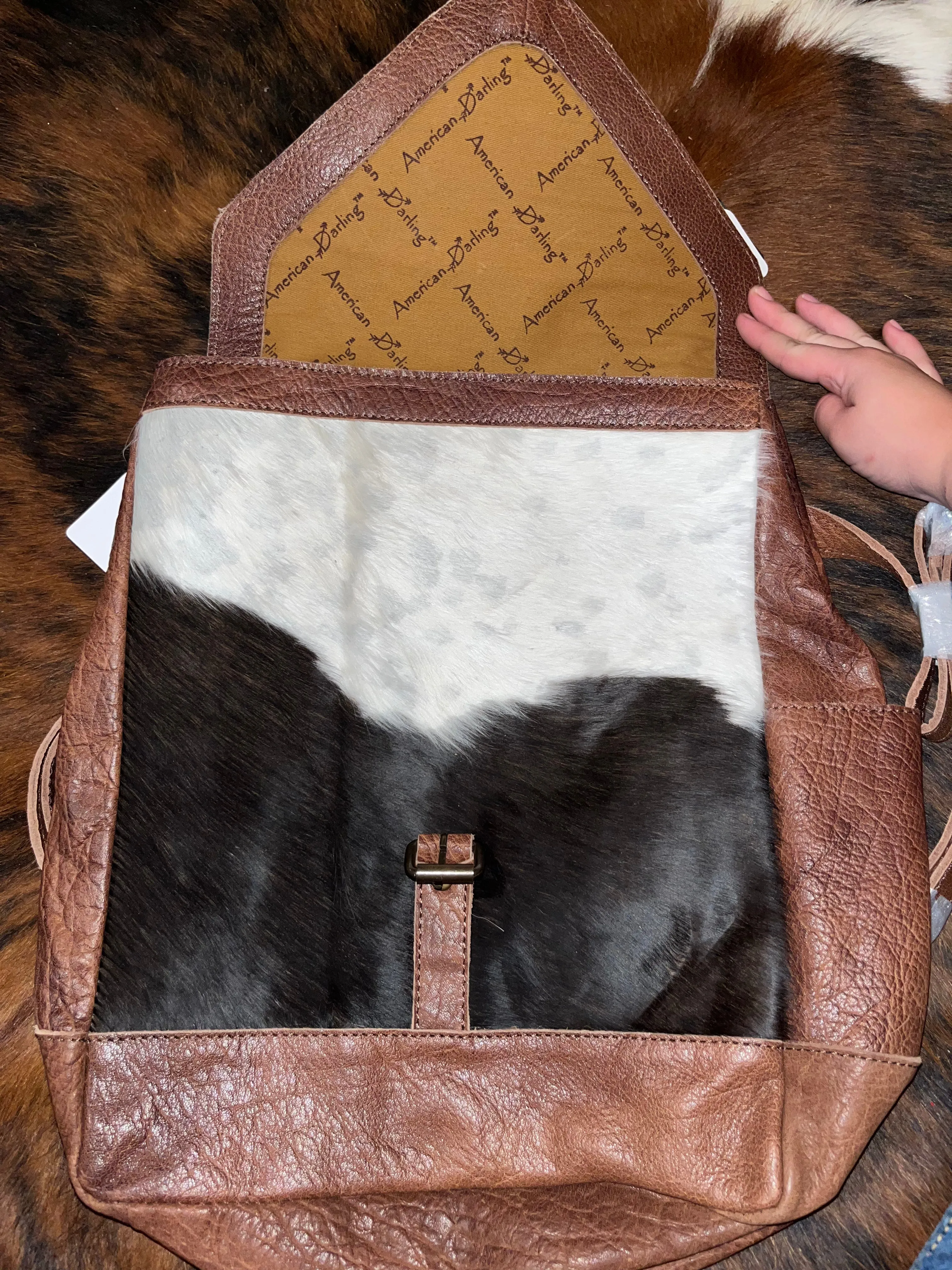 Cowhide and tooled leather concealed carry backpack purse