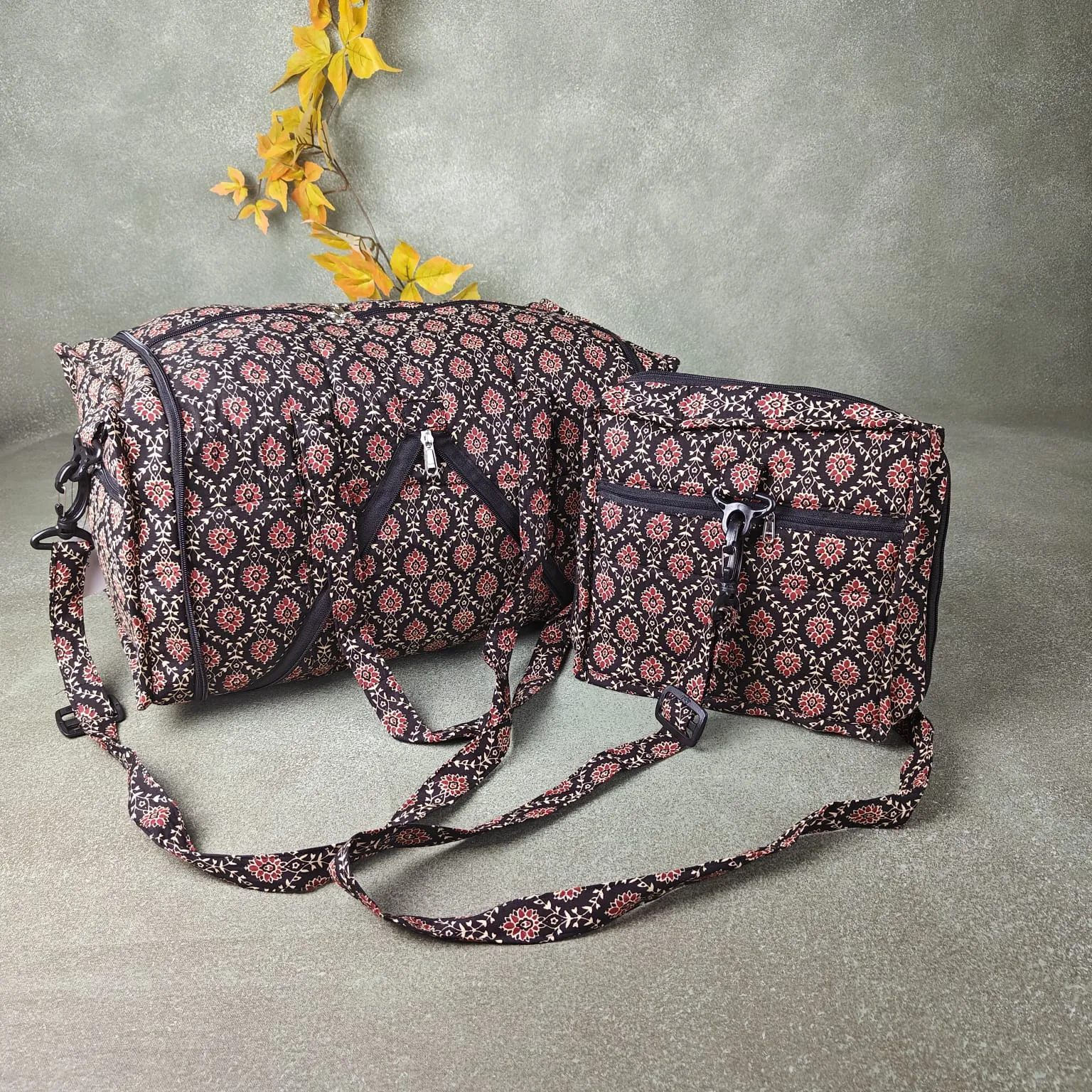 Expandable Travel Bag Black Colour with Sandal and Red Flower Leaf Design.